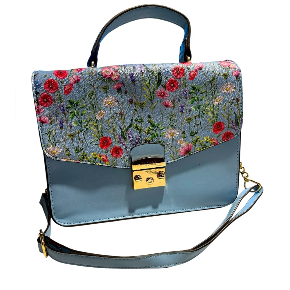 IMAN Global Chic convertible flap handbag with a floral design on the flap